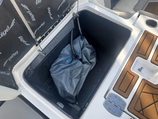 Slide: The Image of 2020 Tigé 25ZX boat storage compartment with ballast bag. - 15