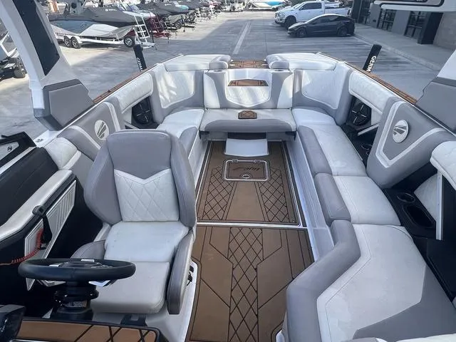 Slide: The Image of 2020 Tigé 25ZX boat interior with luxurious seating and modern design. - 8