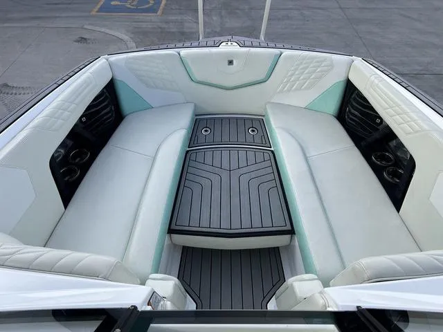Slide: The Image of Interior of 2023 Nautique Super Air Nautique G25 boat with luxurious seating. - 11