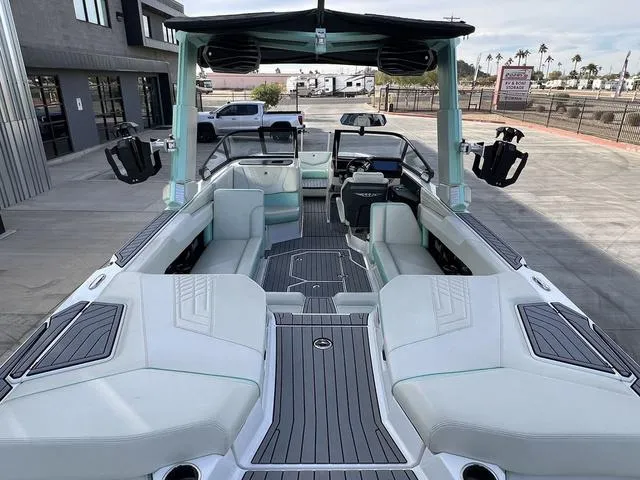 Slide: The Image of 2023 Nautique Super Air Nautique G25 boat interior with sleek seating and modern design. - 12