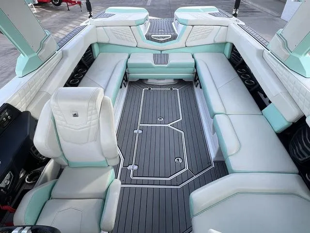 Slide: The Image of 2023 Nautique Super Air Nautique G25 interior with spacious seating and modern design. - 8