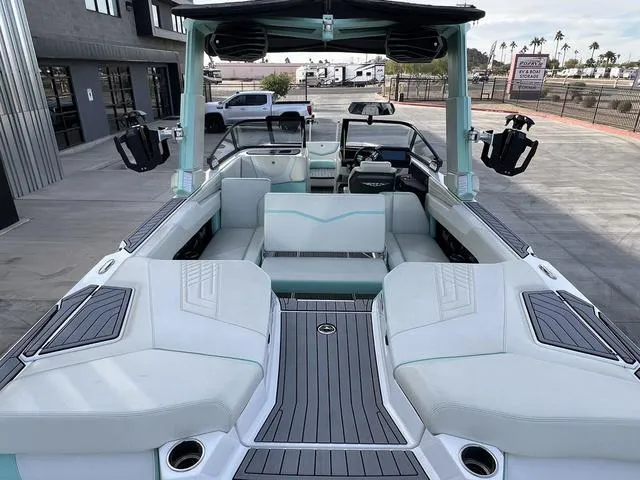 Slide: The Image of 2023 Nautique Super Air Nautique G25 boat with spacious seating and modern design. - 9
