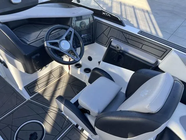 Slide: The Image of 2022 ATX Boats 22 TYPE-S interior with steering wheel and dashboard controls. - 10