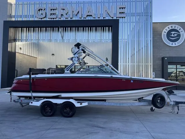 Slide: The Image of 2010 MasterCraft X45 boat on trailer in front of Germaine dealership. - 1