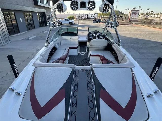 Slide: The Image of 2010 MasterCraft X45 boat interior with stylish seating and audio system. - 12
