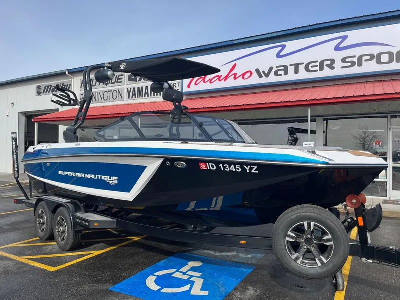 Slide: The Image of 2020 Nautique GS22 boat on trailer at Idaho Water Sports dealership. - 12