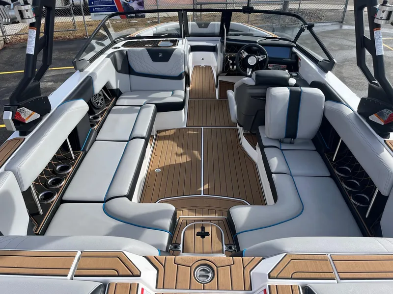 Slide: The Image of 2020 Nautique GS22 boat interior with spacious seating and modern design. - 18
