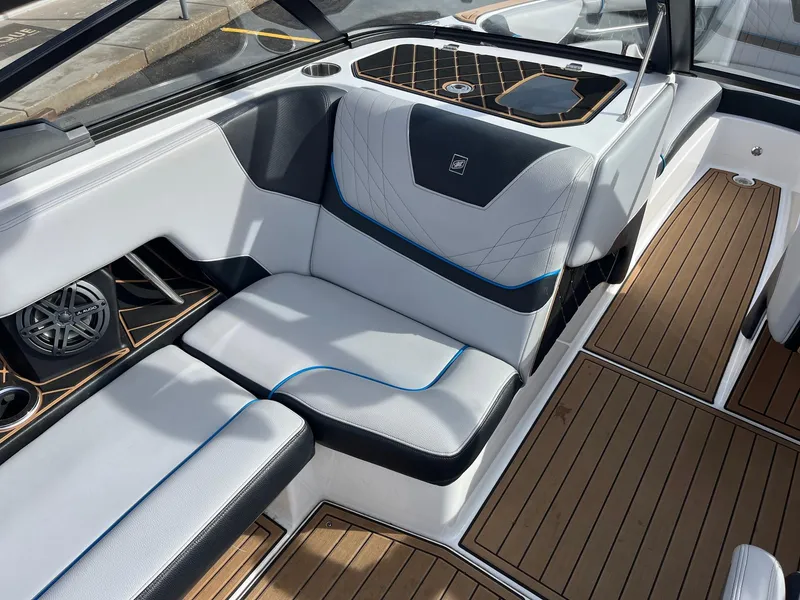 Slide: The Image of 2020 Nautique GS22 interior with sleek seating and modern design elements. - 25