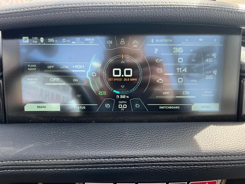 Slide: The Image of 2020 Nautique GS22 dashboard display showing speed, temperature, and system controls. - 29