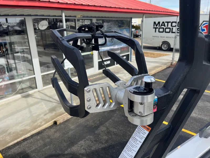 Slide: The Image of 2020 Nautique GS22 wakeboard rack, close-up view, with dealership background. - 35