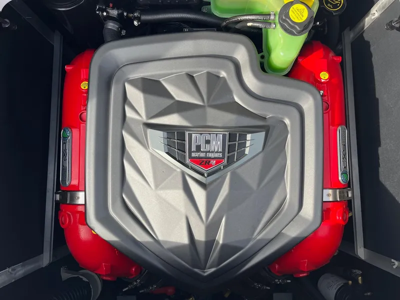 Slide: The Image of 2020 Nautique GS22 PCM engine with red accents and geometric cover design. - 38