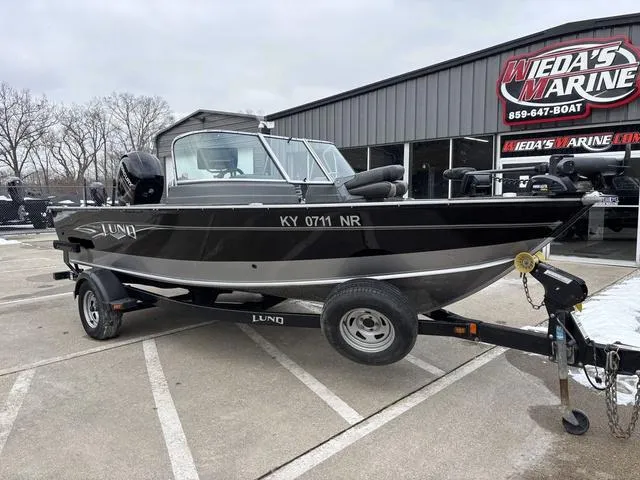 Slide: The Image of 2015 Lund Impact 1875 SS boat on trailer at Weda's Marine dealership. - 10