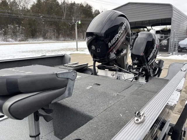 Slide: The Image of 2015 Lund Impact 1875 SS boat with Mercury outboard motors in a snowy setting. - 15
