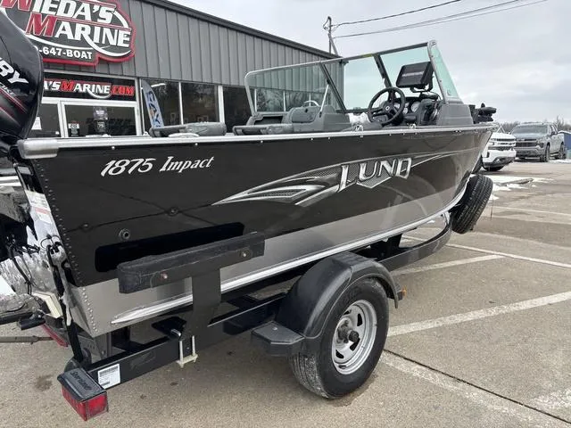 Slide: The Image of 2015 Lund Impact 1875 SS boat on trailer at dealership parking lot. - 4