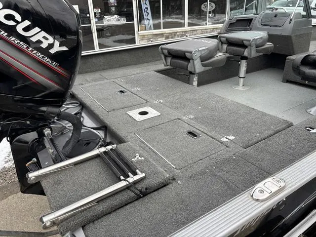 Slide: The Image of 2015 Lund Impact 1875 SS boat interior with Mercury engine and seating. - 5