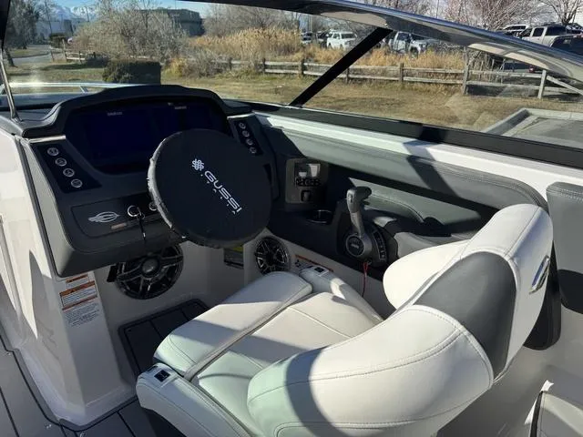 Slide: The Image of 2024 Chaparral 247 SSX boat cockpit with modern steering and controls. - 11