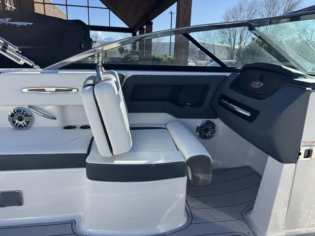 Slide: The Image of 2024 Chaparral 247 SSX boat interior with sleek seating and modern dashboard design. - 13