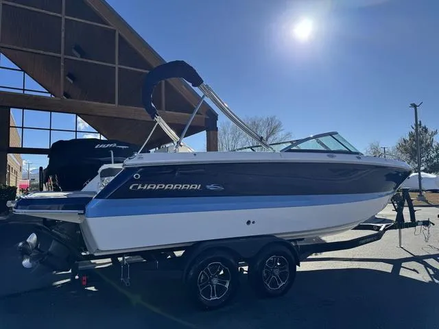 Slide: The Image of 2024 Chaparral 247 SSX boat on trailer under clear sky. - 7