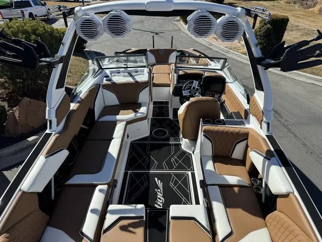Slide: The Image of 2025 Tigé 24RZX boat interior with luxurious seating and advanced audio system. - 7