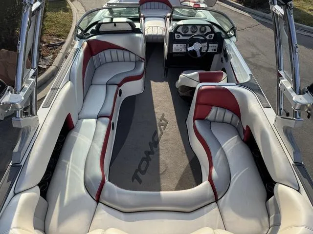 Slide: The Image of 2014 MB SPORTS F24 Tomcat boat interior with white and red seating. - 12
