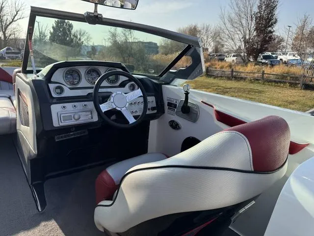 Slide: The Image of 2014 MB SPORTS F24 Tomcat boat interior with steering wheel and dashboard. - 13