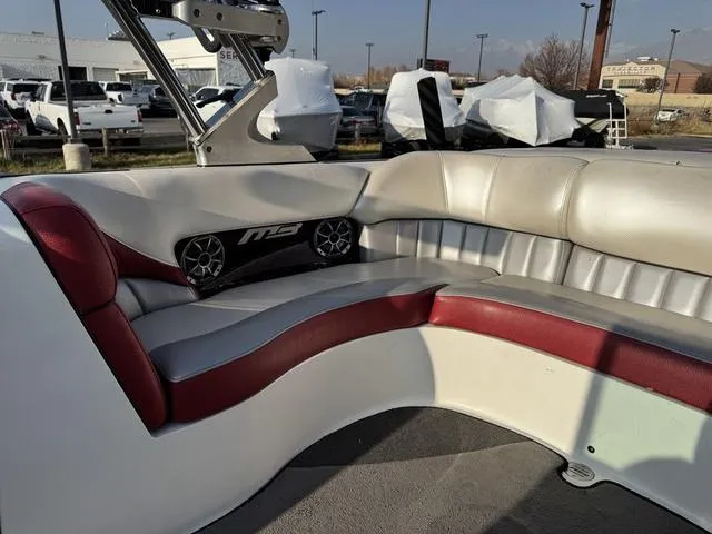 Slide: The Image of 2014 MB SPORTS F24 Tomcat boat interior with red and white seating. - 17