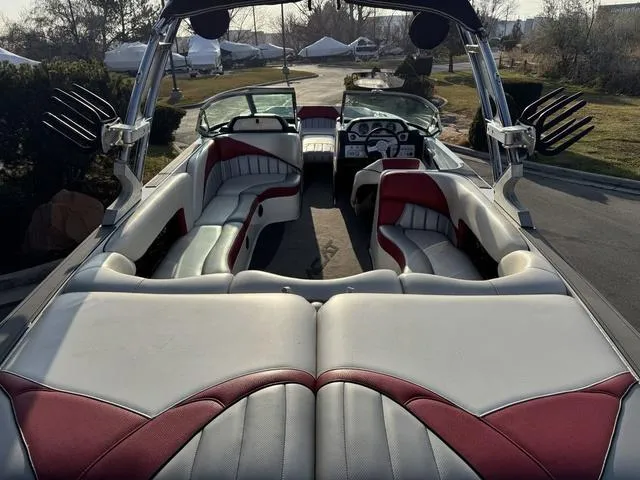 Slide: The Image of 2014 MB SPORTS F24 Tomcat boat interior with red and white seating. - 19