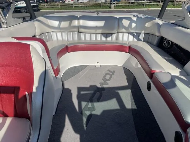Slide: The Image of 2014 MB SPORTS F24 Tomcat boat interior with red and white seating. - 20