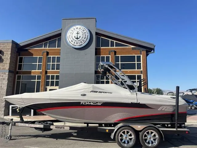 Slide: The Image of 2014 MB SPORTS F24 Tomcat boat on trailer outside a marina building. - 3