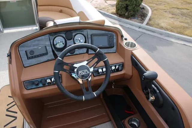 Slide: The Image of 2025 Avalon LSV Quad Lounger Shift dashboard with modern controls and steering wheel. - 6
