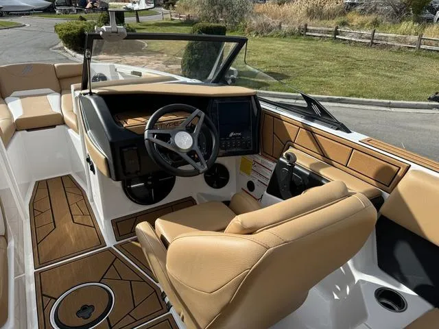 Slide: The Image of 2023 ATX Boats 22 TYPE-S interior with tan seating and modern dashboard. - 11