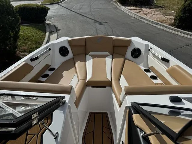 Slide: The Image of 2023 ATX Boats 22 TYPE-S interior with tan seating and cup holders. - 12