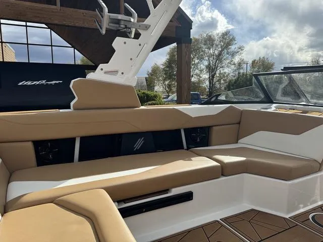 Slide: The Image of 2023 ATX Boats 22 TYPE-S interior with tan seating, sleek design, and modern features. - 14