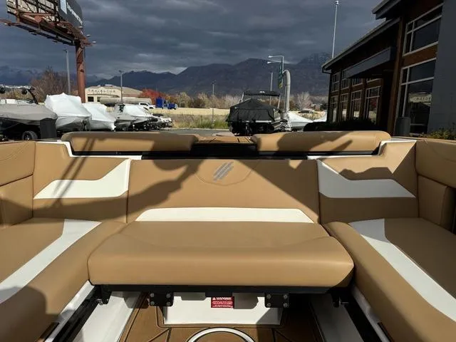 Slide: The Image of 2023 ATX Boats 22 TYPE-S interior with tan and white seating, outdoor setting. - 15