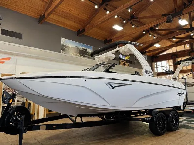 Slide: The Image of 2025 Tigé Z3 boat displayed indoors on a trailer, showcasing sleek design and modern features. - 1