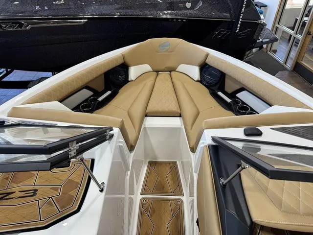 Slide: The Image of 2025 Tigé Z3 boat interior with tan seating and stylish design. - 7