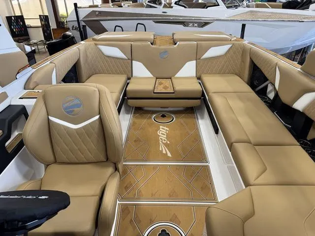 Slide: The Image of 2025 Tigé Z3 boat interior with luxurious tan seating and stylish wood accents. - 8