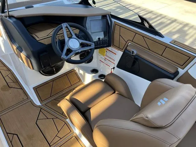 Slide: The Image of 2024 ATX Boats 24 TYPE-S interior with tan seats and modern dashboard. - 10