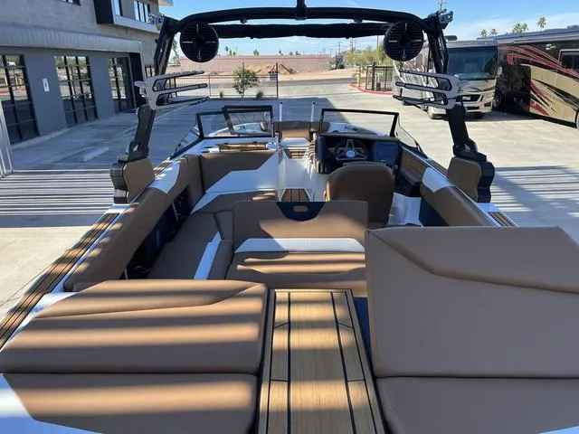 Slide: The Image of 2024 ATX Boats 24 TYPE-S interior with tan seating and modern dashboard. - 11