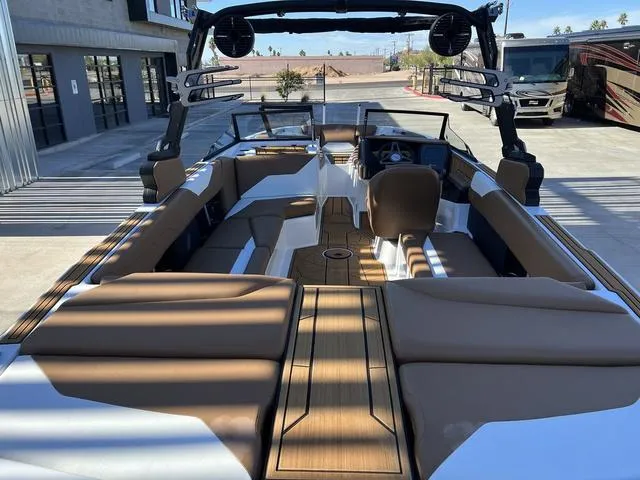 Slide: The Image of 2024 ATX Boats 24 TYPE-S interior with brown seating and sleek design. - 12