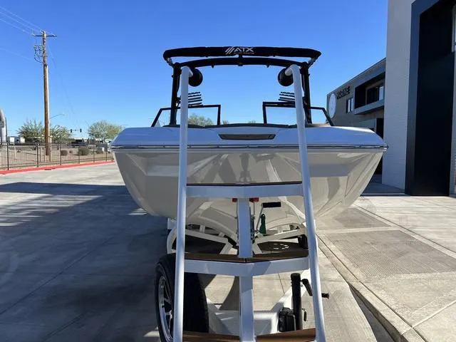 Slide: The Image of 2024 ATX Boats 24 TYPE-S on trailer, parked outdoors, front view. - 5