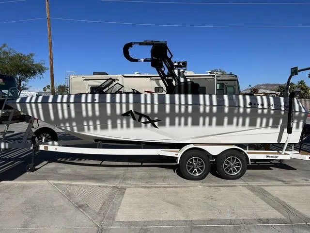 Slide: The Image of 2024 ATX Boats 24 TYPE-S on trailer, parked outdoors under sunlight. - 7