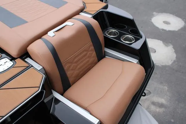 Slide: The Image of 2024 Malibu 26 LSV boat dashboard with modern steering and digital controls. - 6