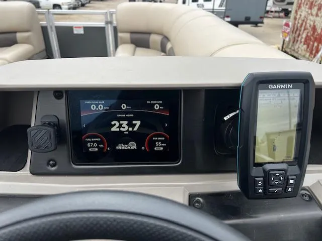 Slide: The Image of Dashboard of 2024 Sun Tracker 20PB with Garmin GPS and digital display. - 8
