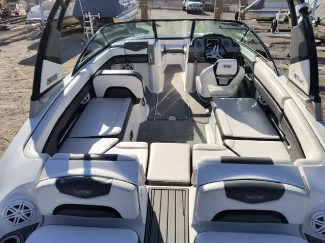 Slide: The Image of 2016 Chaparral Vortex 223 VRX boat interior with spacious seating and modern dashboard. - 12