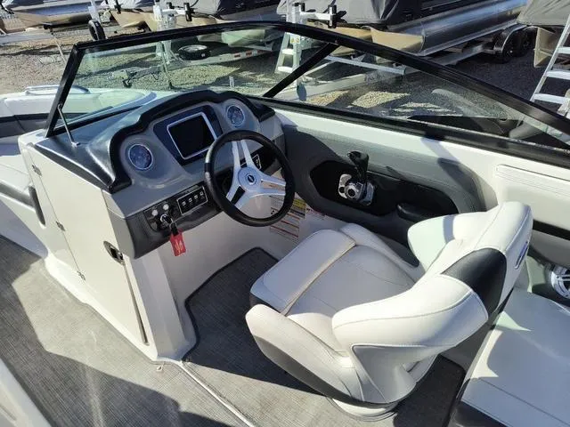 Slide: The Image of 2016 Chaparral Vortex 223 VRX boat interior with steering wheel and dashboard. - 14