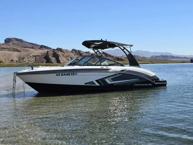 Slide: The Image of 2016 Chaparral Vortex 223 VRX boat on clear water with scenic mountain backdrop. - 4