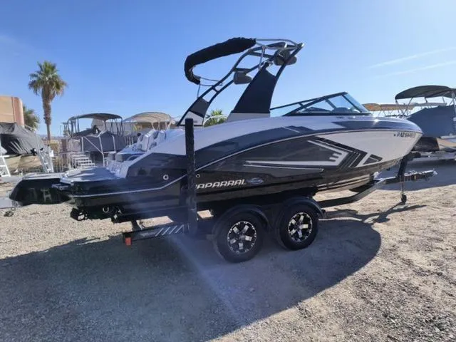 Slide: The Image of 2016 Chaparral Vortex 223 VRX boat on trailer, parked outdoors under clear sky. - 5