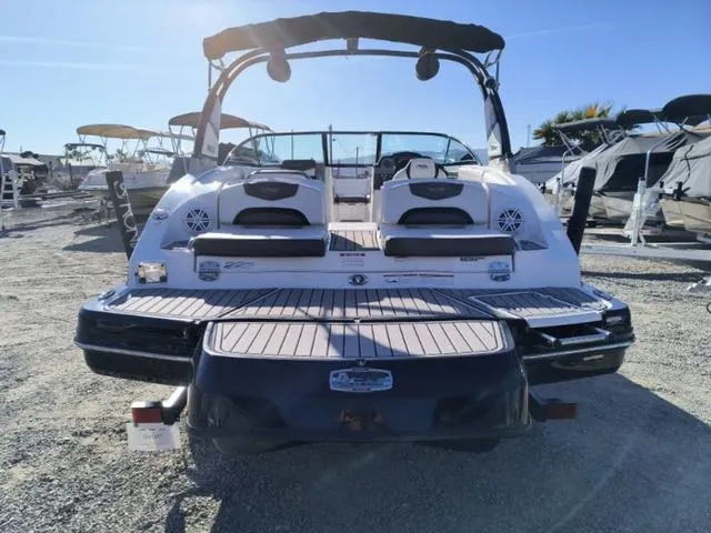 Slide: The Image of 2016 Chaparral Vortex 223 VRX boat, rear view, in a sunny outdoor setting. - 7