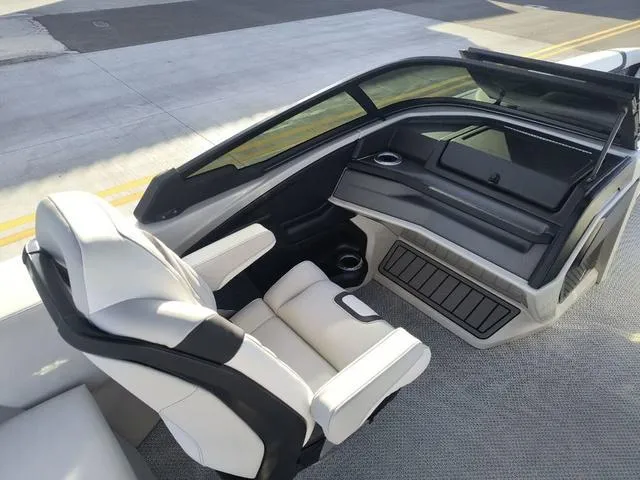 Slide: The Image of 2025 Avalon Excalibur Quad Lounge Windshield 27 FT interior with sleek seating and modern design. - 14